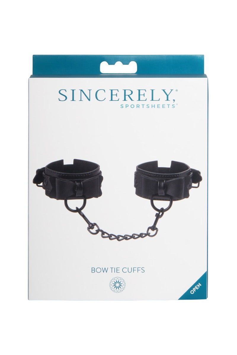 Sportsheets Sincerely Bow Tie Faux Leather Wrist Cuffs – Faux Leather Wrist Cuffs > Bondage Gear > Restraints